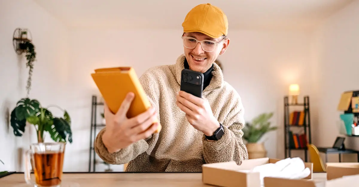 A yellow dimensional mailer box has a white branded vinyl sunglasses case inside.